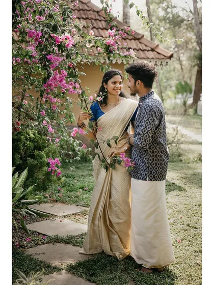 A beautiful portrait of a couple surrounded by bougainvillea flowers.