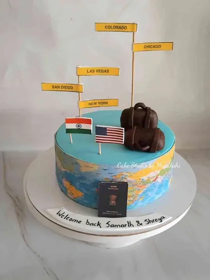 A 'Welcome Back' cake for Samarth and Shreya. The cake is a globe, highlighting their travels in the USA before returning to India.