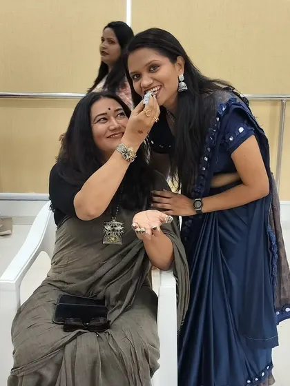 A sweet moment of celebration with my guru after completing my course. Her encouragement and support mean the world to me.