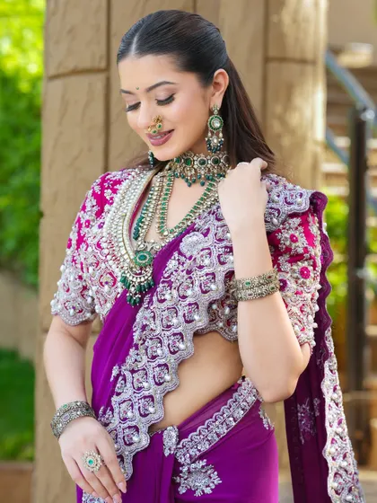 A moment of elegance. The makeup is designed to be timeless, with a soft glow that enhances her features without competing with the intricate details of her look.
