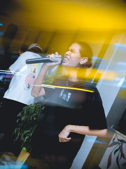 A live rap performance heating up the night. My events often feature more than just DJs, incorporating live MCs and rappers to elevate the energy.