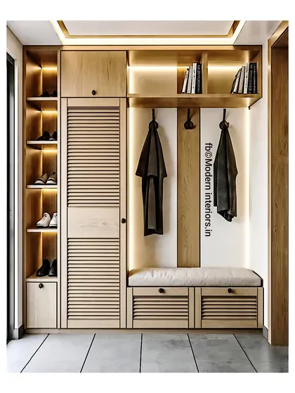 A clean and modern entryway unit with louvered doors and a comfortable seating bench. The open shoe shelves at the bottom are lit, making it easy to find what you're looking for.
