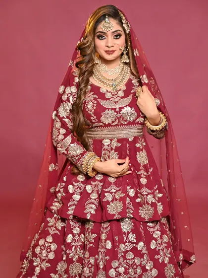 This full-length shot shows how the makeup and hair complete the entire bridal look, making the model look regal and beautiful.