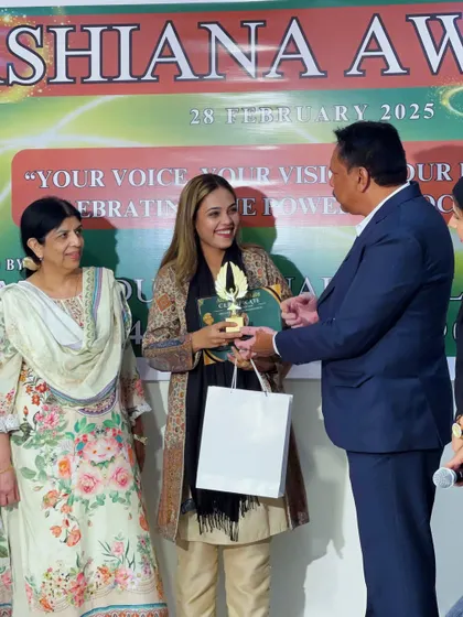 A proud moment, receiving my award on stage. I am so grateful for the support and appreciation.