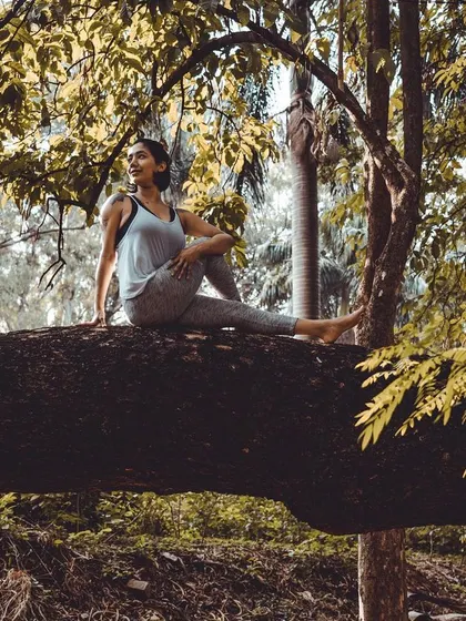 A gentle seated twist, Ardha Matsyendrasana, on a fallen tree branch. Spinal twists are wonderful for releasing tension and improving digestion, and practicing them outdoors feels incredibly refreshing.