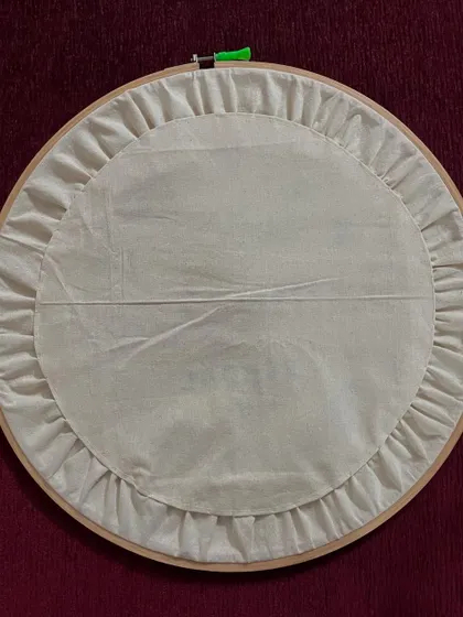 The back of my embroidered logo hoop. I always teach my students the importance of a neat finish, and I practice it in my own work as well.