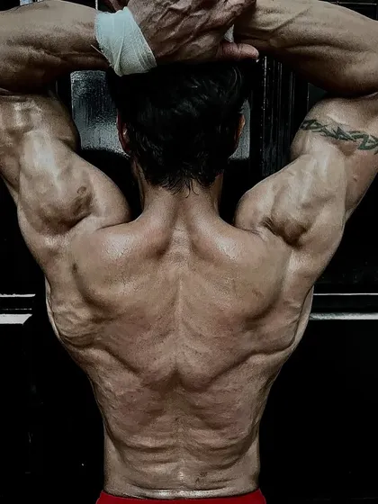 The back be backing. A Baki-inspired pose showing a "demon back" level of muscularity and definition.