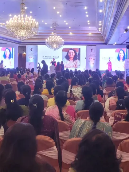 A wide shot of the audience viewing a presentation on our dual-screen setup. The large, bright displays ensure clarity even in a large, well-lit hall.