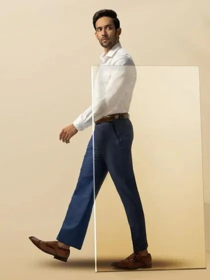 For Blackberrys Menswear, the concept was 'Upgrade Your Fit'. I styled the model in a crisp white shirt and perfectly tailored trousers to create a clean, modern, and aspirational look that emphasizes movement and fit.