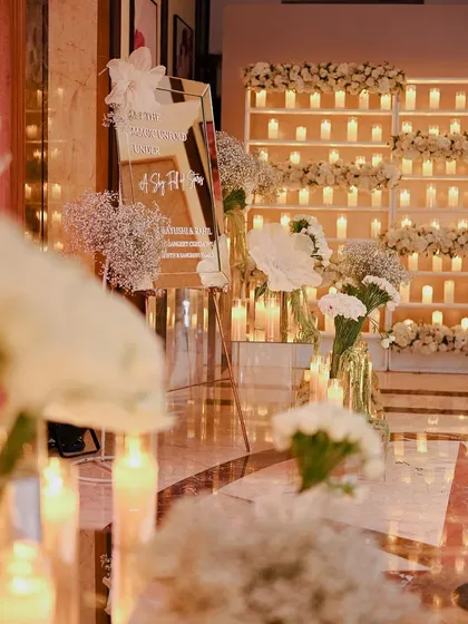 The welcome area, where a mirrored sign and candle walls set a glamorous tone for the evening.