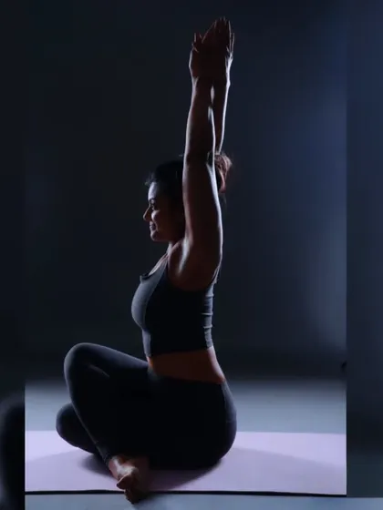As a seeker, yoga is an inner revolution. This seated Gomukhasana, or Cow Face Pose, is a powerful hip opener that also encourages an upright posture, helping to align the spine.