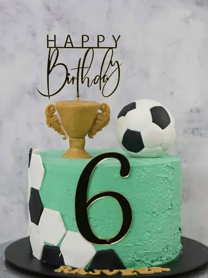 A banger of a cake for a little football champion turning six. This custom themed cake features a football, a trophy, and the birthday boy's name, making his big day even more memorable.