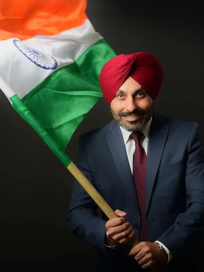 A proud and patriotic portrait for a professional profile. Incorporating the Indian flag adds a layer of personal identity and pride, making this corporate headshot stand out.