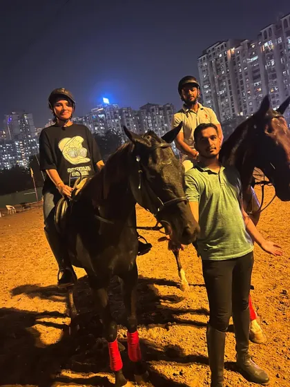 A group of friends and a trainer pose for a photo after a fun night ride. It's a great way to socialize and share a unique experience.