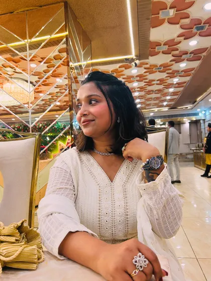 Taking a moment to enjoy the beautiful decor of the venue. I appreciate all the hard work that goes into creating a beautiful event, and I make sure my hosting complements the ambiance you've so carefully created.