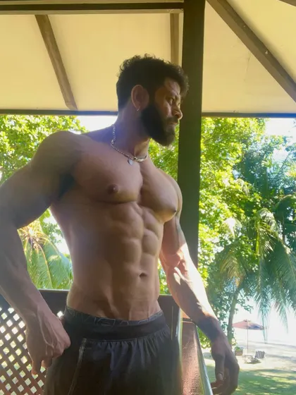 Enjoying the view after a workout. A lean and muscular physique is something you carry with you everywhere, a result of the hard work you put in.