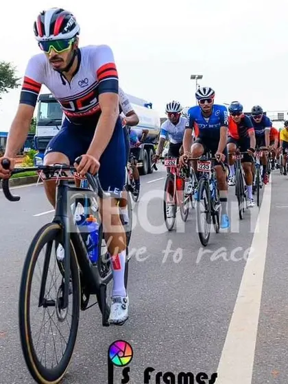An elite rider, leading the peloton in a long and grueling race.