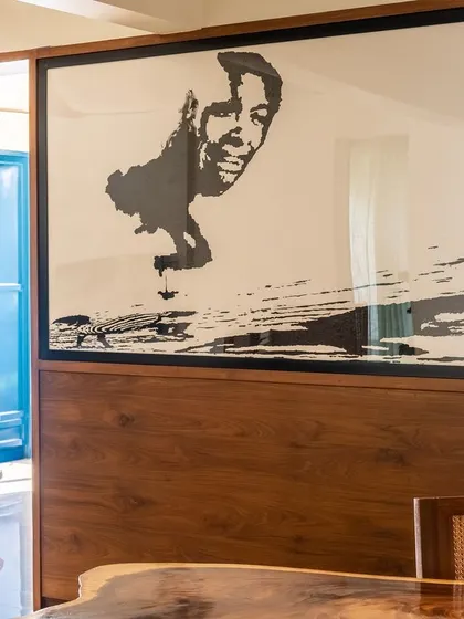This large art piece, found on a trip to Harvard University, has traveled with us for 15 years and now has a dedicated wall in our dining area.