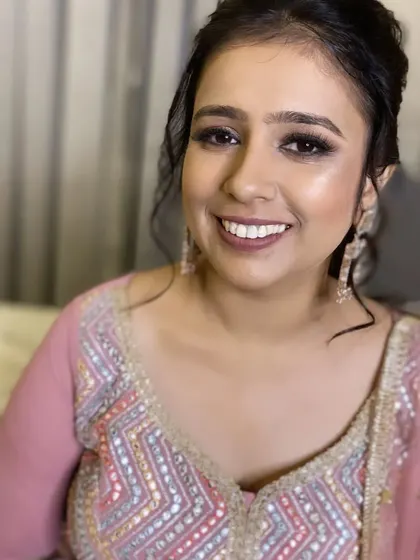 A close-up portrait of this cocktail party makeup. The focus is on flawless skin and beautifully defined eyes.