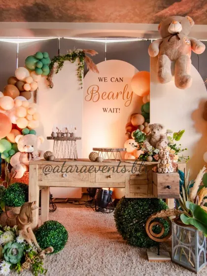 A full view of the "We Can Bearly Wait" baby shower setup. The rustic wooden table, teddy bears, and earthy-toned balloon arch create a warm, cozy, and stylish atmosphere.