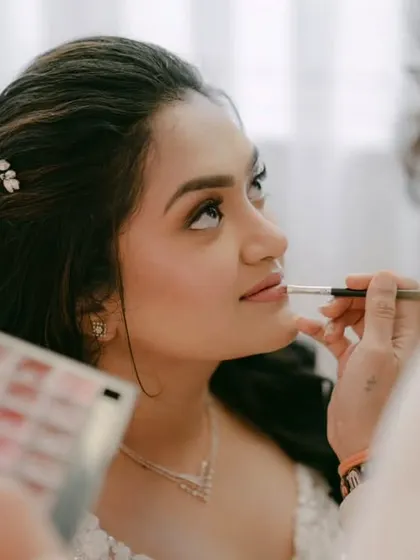 "Make me look like me but better" is what I hear all the time, and it's my philosophy. This behind-the-scenes shot shows the final lip application for a fresh and timeless bridal look.