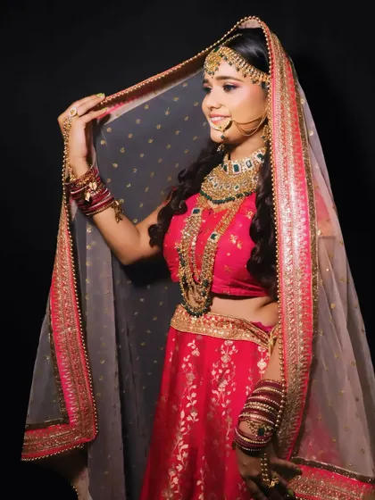 A full-length shot of a bride, demonstrating how the makeup and styling come together to create a breathtaking final look.