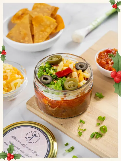 Even our Mexican Layered Dip gets into the Christmas spirit with its festive layers of red salsa and green toppings.