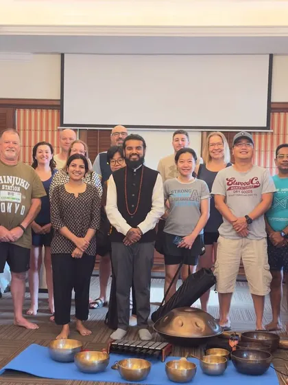 A group photo with the international team after a successful wellness workshop.