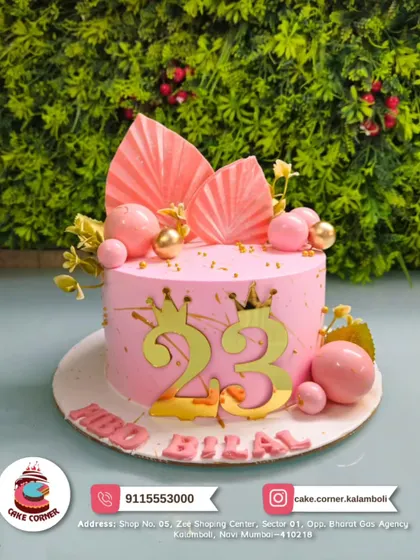 A chic pink cake for Bilal's 23rd birthday. The gold numbers, crowns, and modern fan decorations make it a stylish and royal choice for a milestone celebration.
