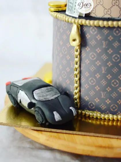 The details matter, like this tiny sculpted car and the zipper on the Louis Vuitton-patterned tier.