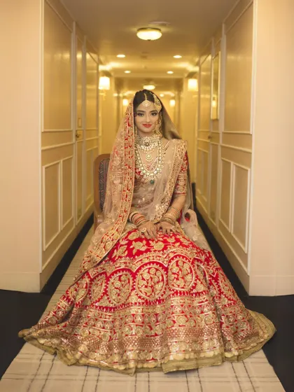 A regal bridal portrait in a beautifully lit heritage hotel corridor. I work to make every bride feel like royalty, capturing the elegance of her attire and the quiet confidence before she walks down the aisle.