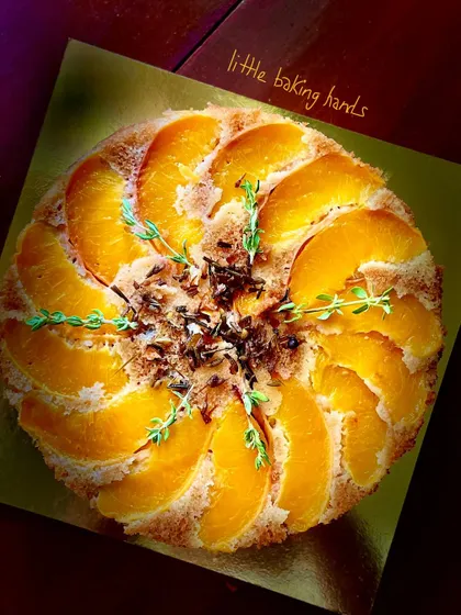 A beautiful upside-down peach and lavender cake. The peaches are arranged in a lovely pattern on top, and the lavender adds a delicate floral note.
