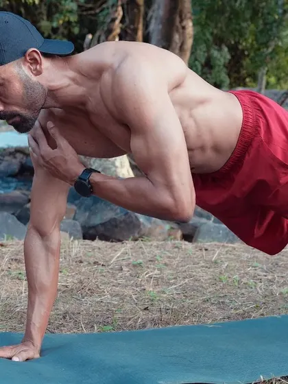 The only part you control is your effort. This plank with a shoulder tap is a great example of a core-stabilizing exercise that builds a rock-solid midsection.