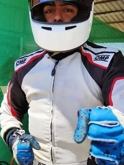 A close up of a driver ready for pre-season testing.
