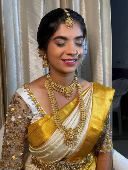 A smiling shot of Shanthala. Her makeup is designed to enhance her natural features and give her a beautiful bridal glow that looks effortless.