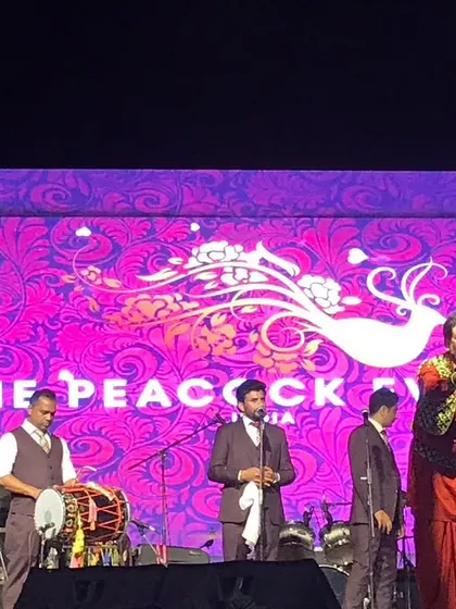 Capturing the moment. Gurdas Maan engaging with the crowd during the successful concert we organized. Our event management services include full artist liaison and on-stage support.