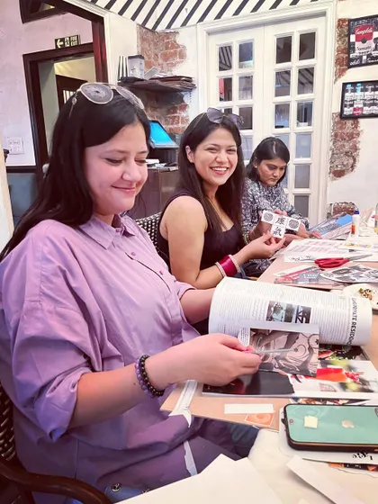 Busy manifesting. The focus and joy on everyone's faces during a vision board party is what makes these events so special. It's a dedicated time to put your energy into what you truly want to attract.