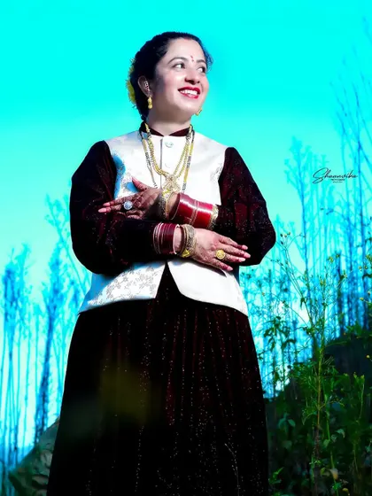 A confident three-quarter portrait of the bride against a bright blue sky. The lighting technique used here makes the subject stand out beautifully.