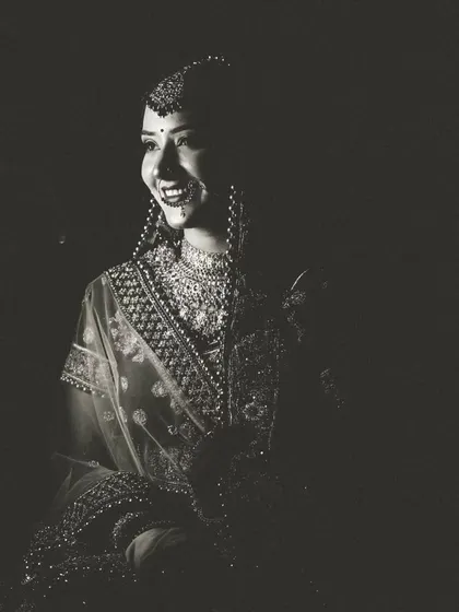 A beautiful black and white bridal portrait, where the play of light and shadow creates a timeless and classic feel.