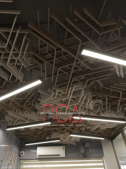 Another perspective of the acoustic ceiling at StyleIn Homes, showing its integration with the office's lighting and air conditioning systems. This view emphasizes the functional and aesthetic synthesis in my designs.