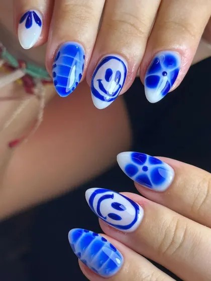 Don't worry, be happy. This fun, graphic set in blue and white features hand-painted smiley faces and other cool patterns.