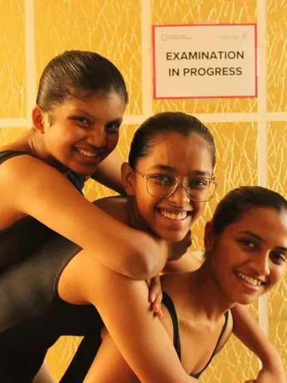 Post-exam smiles and relief. The camaraderie and shared experience make the challenge of exams a bonding moment.
