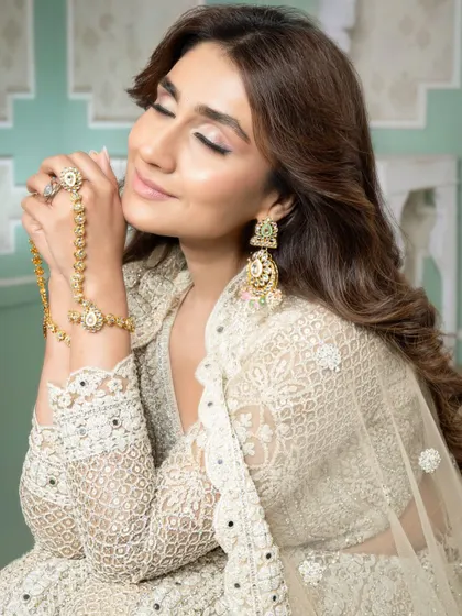 A close-up capturing the dreamy quality of the makeup. The soft focus on the eyes and the radiant skin are hallmarks of the sophisticated techniques our students learn.