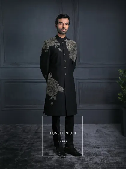 In the dark canvas of black, the embroidery blooms like light. A perfect balance of power and poetry, crafted for the modern gentleman.