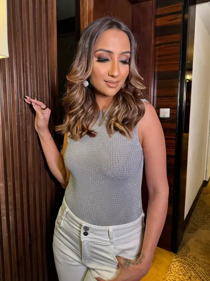 Another angle of Parul's smokey eye look. The focus is on blended eyeshadow and highlighted skin, creating a sultry yet sophisticated vibe perfect for a night out.