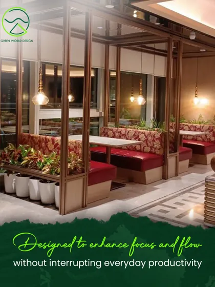 In the cafeteria at The Executive Centre, planters are integrated into the booth seating. This design enhances focus and flow without interrupting productivity, creating intimate dining nooks surrounded by greenery.