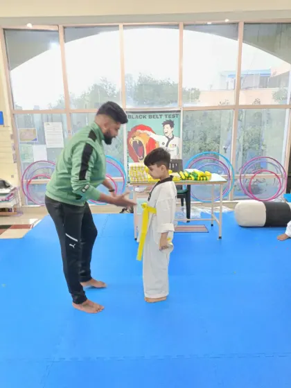 A handshake for a new yellow belt.