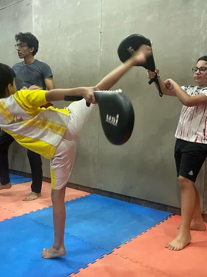 Fifty kicks a day keeps the belly fat away. Our kids' kickboxing classes are designed to be fun while building discipline, coordination, and a strong foundation for fitness.