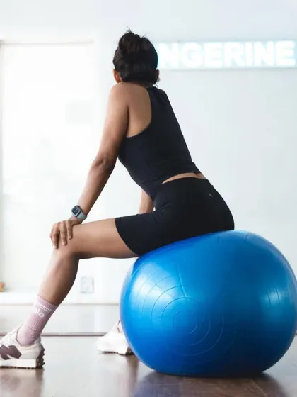 A moment of rest and reflection, perched on a stability ball. Even our pauses are intentional, allowing us to integrate the work we've done.