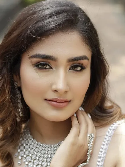 A close-up that captures the sultry essence of the 'Sitara' look. The focus is on the beautifully blended eyeshadow and the glowing, sculpted skin.
